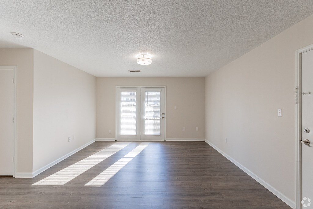 A room with a sliding door and a window.
