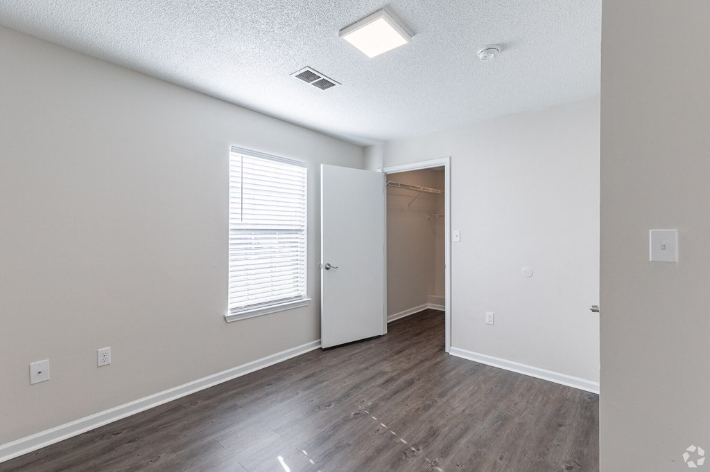 A room with a door and a window.