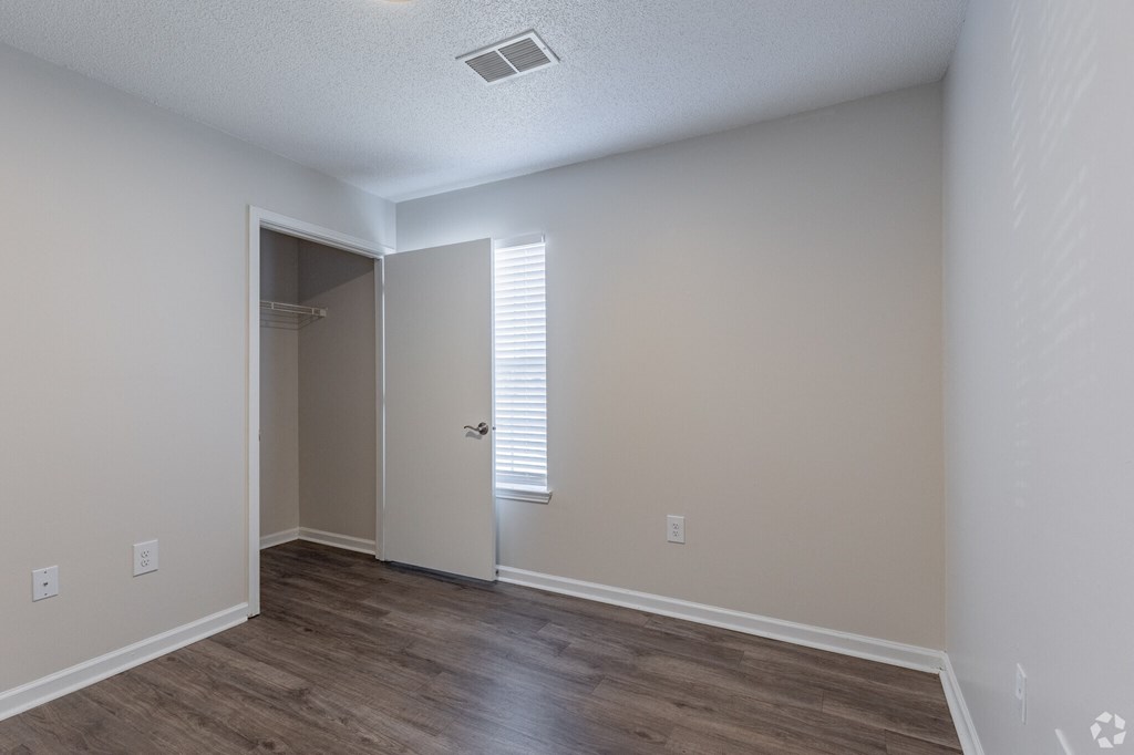 A room with a doorway leading to another room.