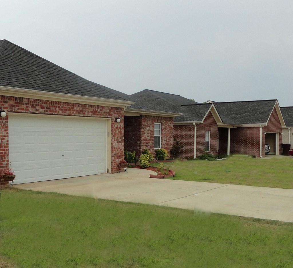 a house with a white garage door in front of it