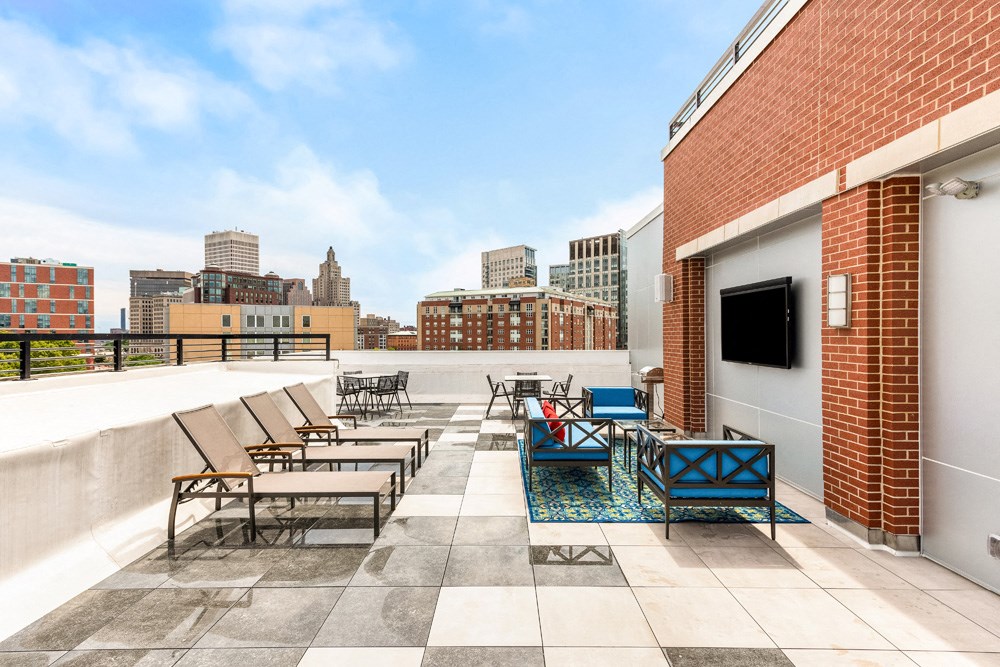 rooftop of station row with sun chairs and tv