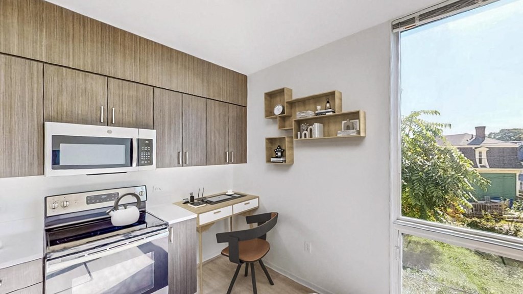 a kitchen with a stove and a microwave