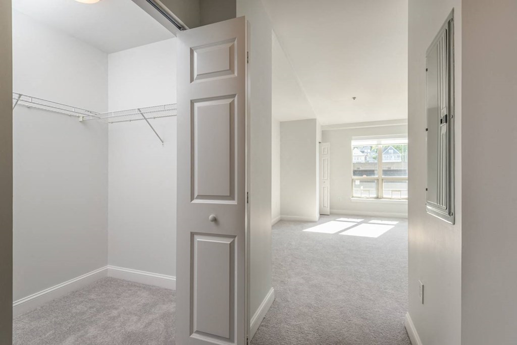 View of the first bedroom with oversized closets in Munroe Place in Quincy, MA