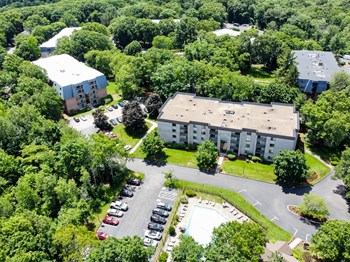 Shrewsburry Commons Apartments in Massachusetts aerial view of pool, leasing office, apartment buildings and tennis courts - Photo Gallery 2