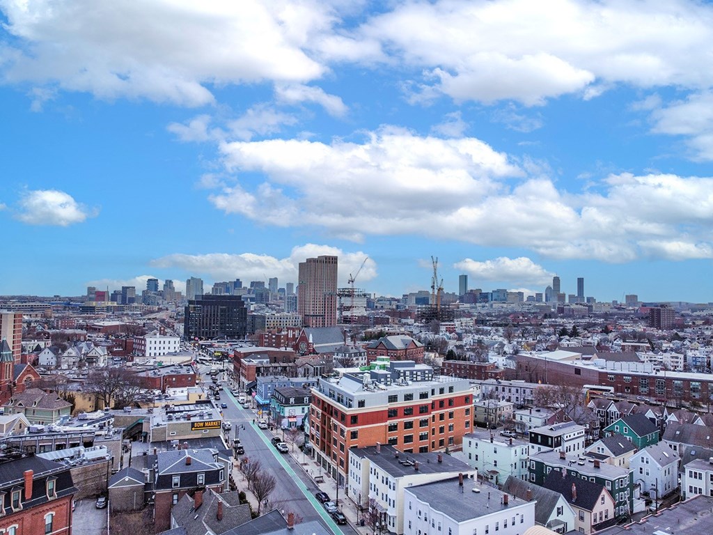 an aerial view of philadelphia with a blue sky and white clouds at Union 346 Apartments, Somerville