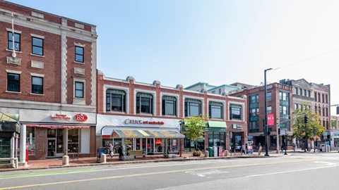 Streetscape featuring Blick Art Materials and nearby shops in Central Square close to 929 Mass Apartments in Cambridge MA