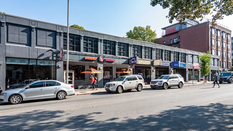 Commercial strip with Dunkin’ and local businesses in Central Square near 929 Mass Apartments in Cambridge MA