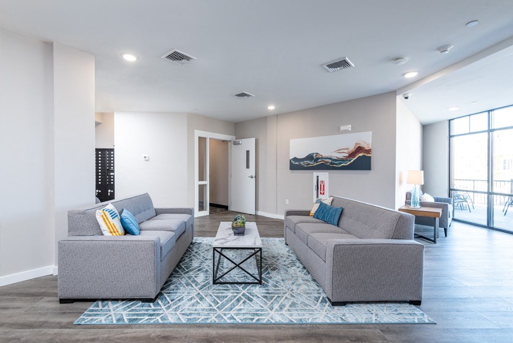 Seating area next to the mail room at Millside at Heritage Park