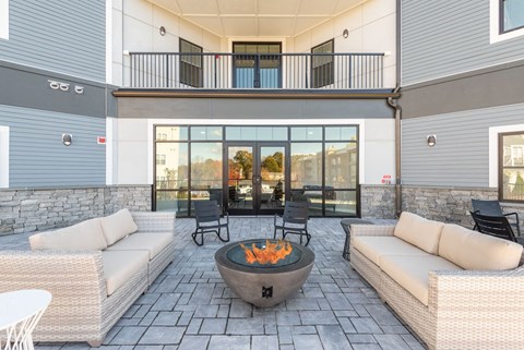 Outside seating with fire pit at Millside