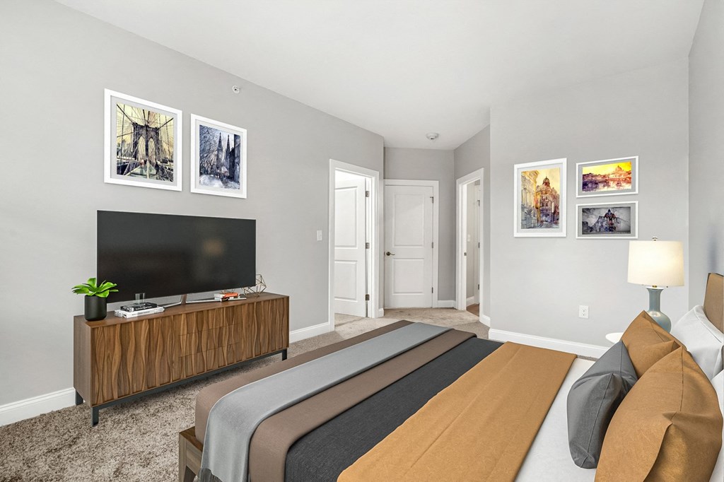 Ashland woods apartments in MA bedroom with carpet flooring and large windows, virtually staged