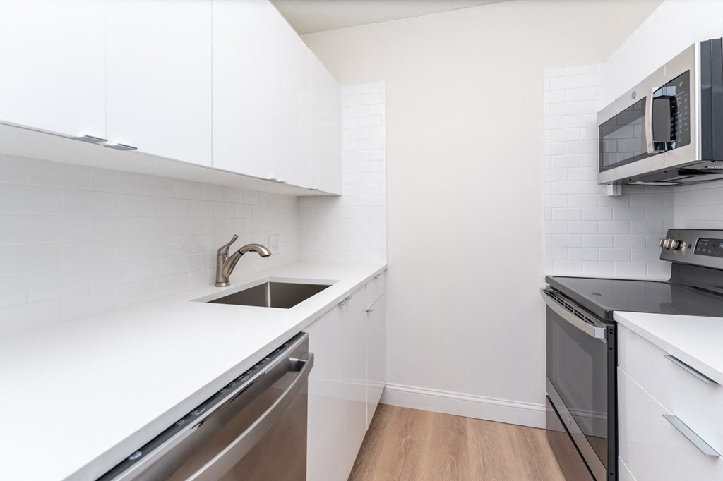 Babcock tower renovated apartment with vinyl wood flooring and stainless steel appliances