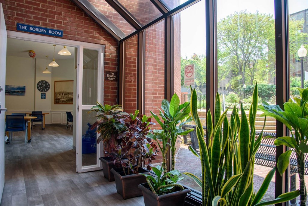 A room with a sign that says "The Garden Room" on the door.