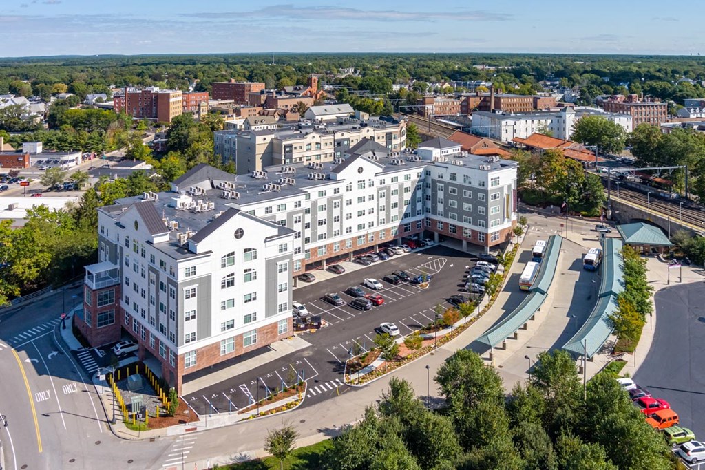 One Wall Street Attleboro Apartments drone view with downtown in background, bus and train station