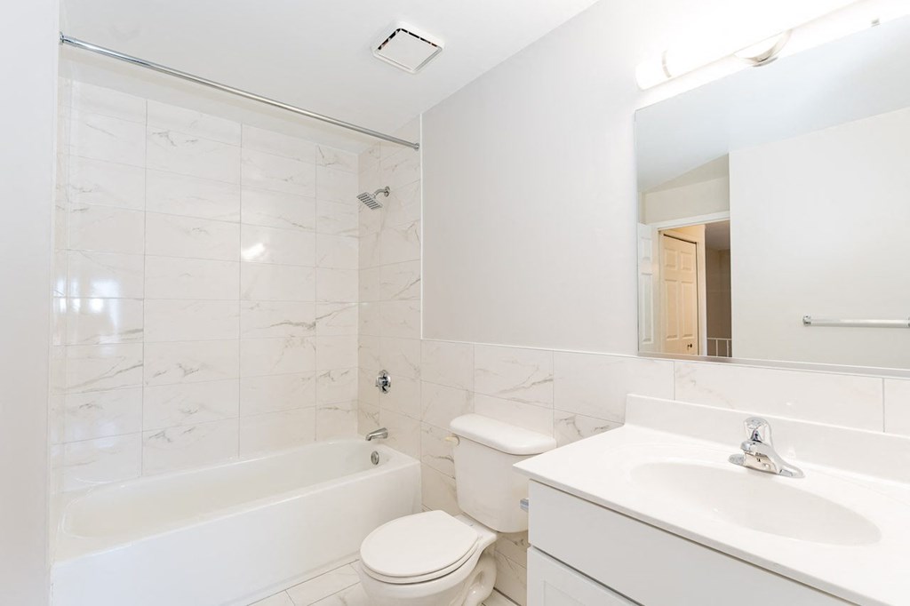 a bathroom with a sink toilet and bathtub