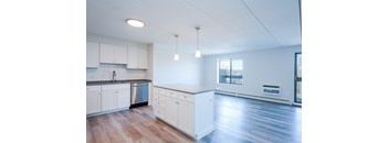 an empty kitchen and living room in an apartment