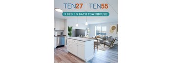 an open floor plan with a large kitchen island and a living room with a couch and a