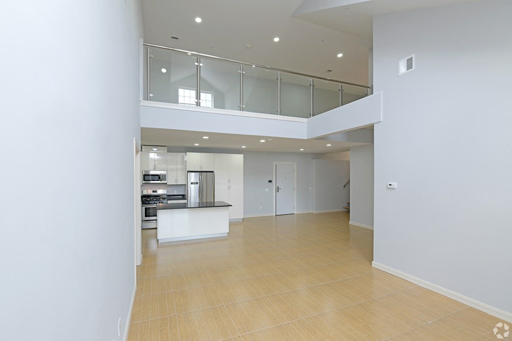 new apartment in stoughton living room area looking back at kitchen and loft