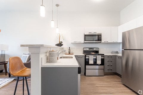 a kitchen with stainless steel appliances and a counter top