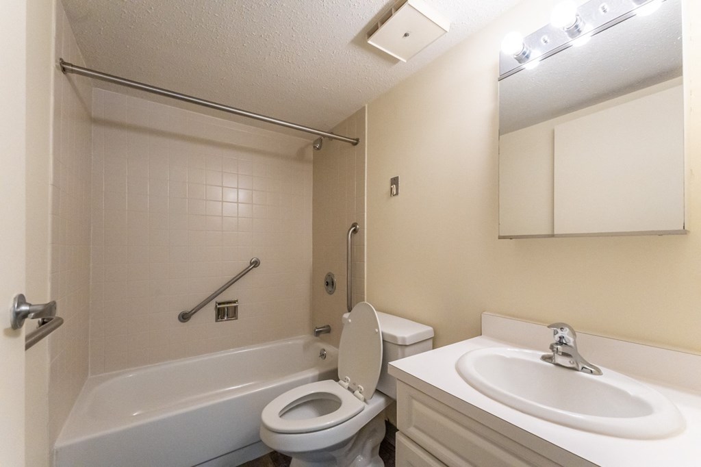 Bathroom with toilet sink and vanity