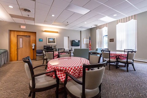 a dining room with a table and chairs