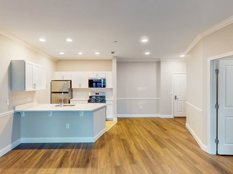 A kitchen with a sink and cabinets.