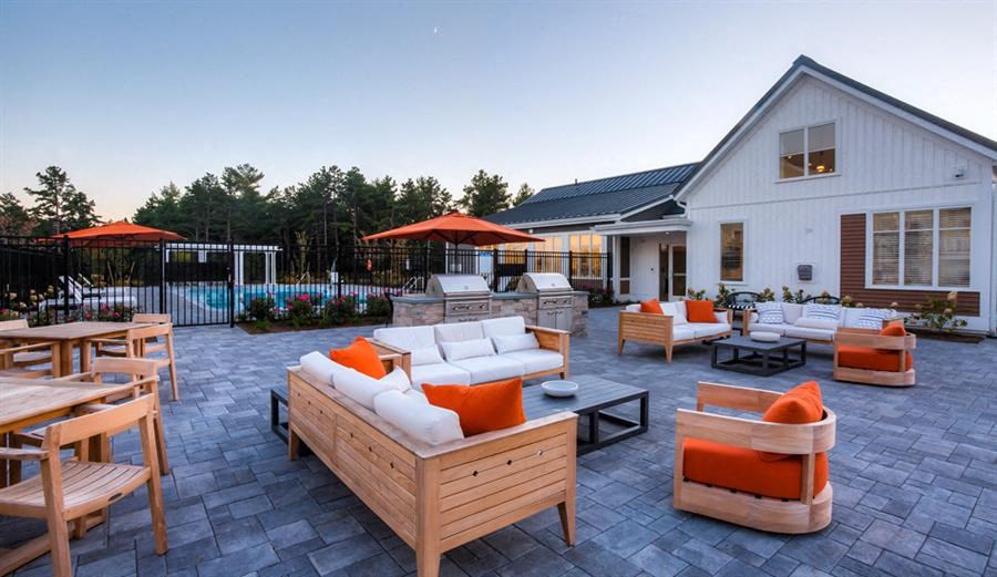 Redbrook leasing center, pool area, outdoor seating, grills and fire pit.