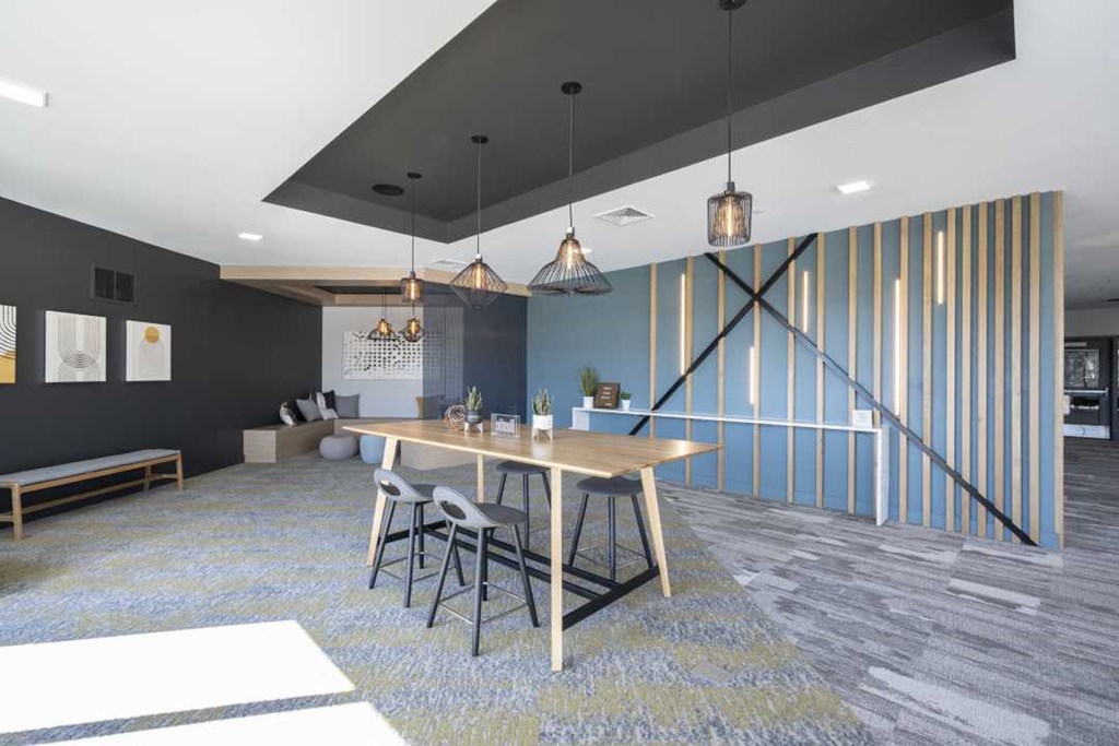 a rendering of a room with a table and chairs and a couch in the background