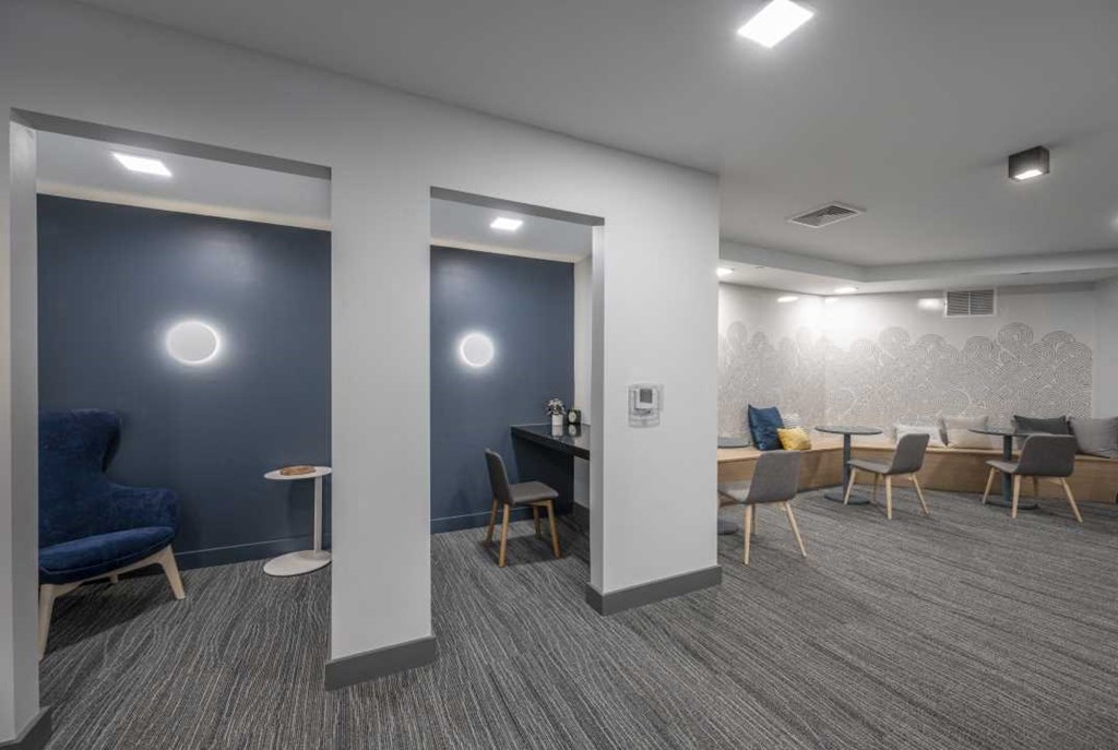 a room filled with furniture and a large window