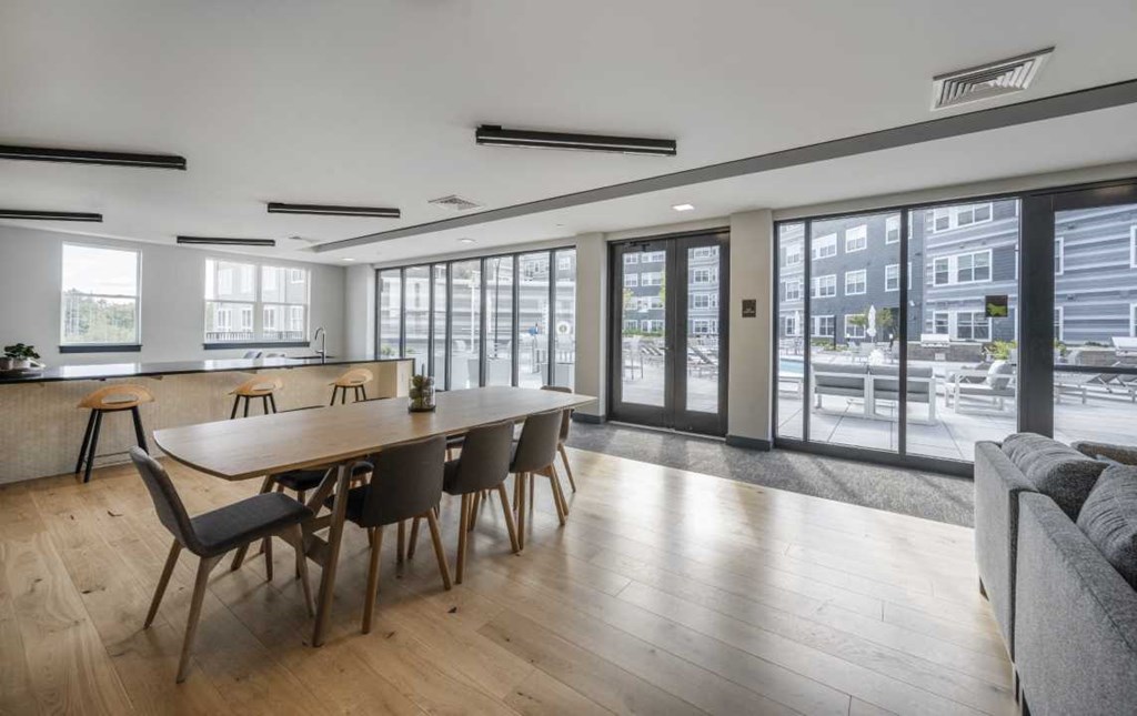 a large room with a long wooden table and chairs