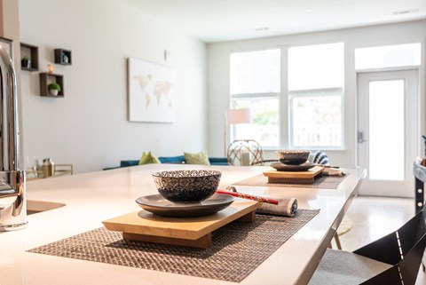 a view of the dining room and living room from the kitchen