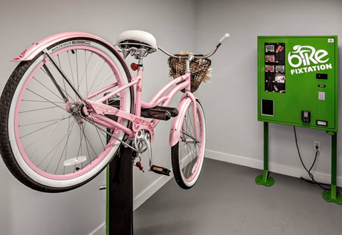 a bike parked on top of a black pole