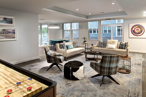 a resident clubhouse with a foosball table and pool table