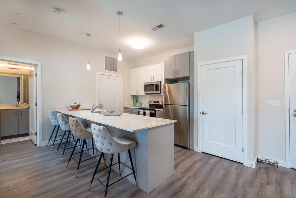 Millside kitchen granite countertops stainless appliances oven range microwave bright finishes