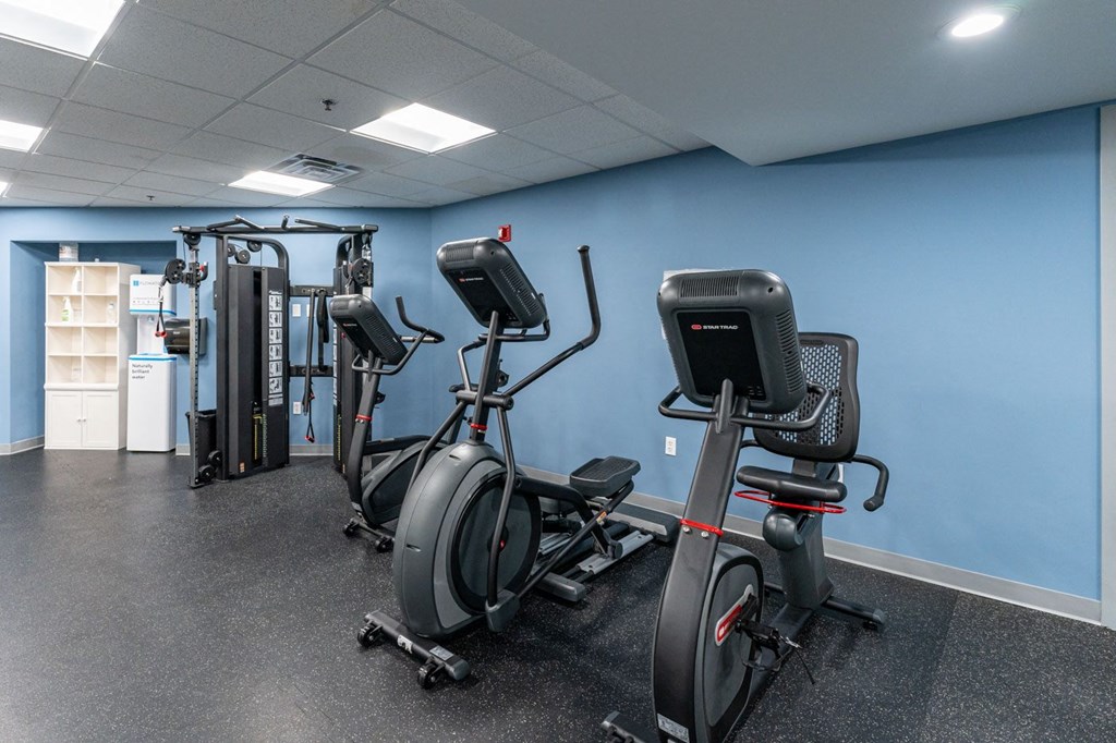 a group of exercise bikes in a room