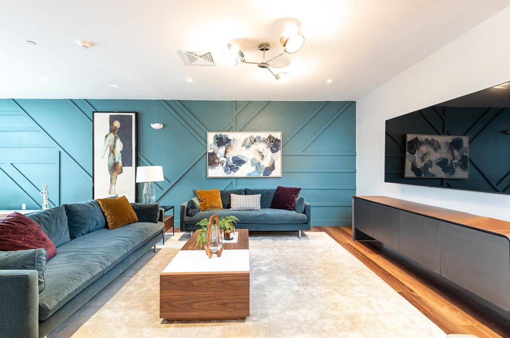 Resident lounge at One Wall St featuring a big screen TV