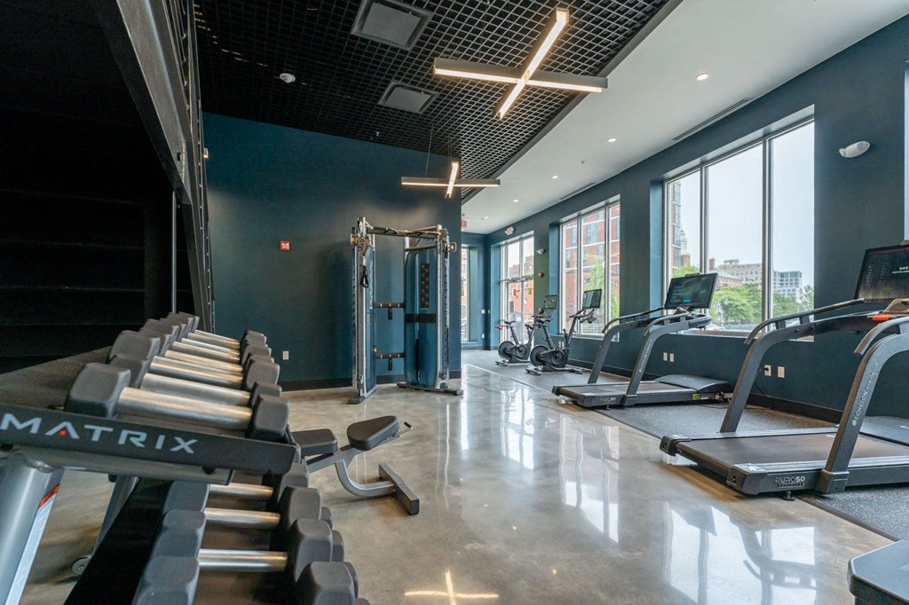 a fitness center with treadmills and other exercise equipment at park row west