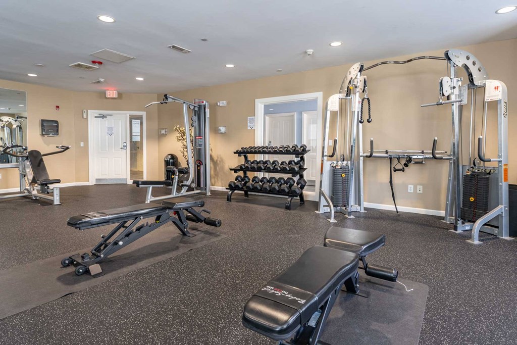 Parkside Commons gym with a variety of equipment including a leg press machine.