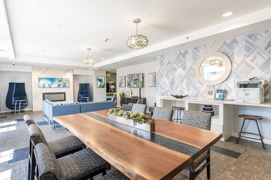 The community lounge at Parkside Commons with a long wooden table and chairs
