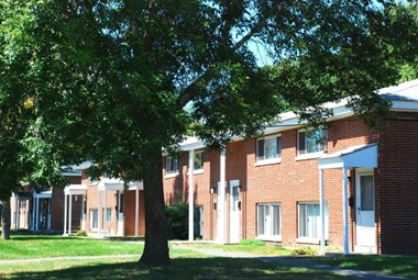 Pelham apartments exterior with tree