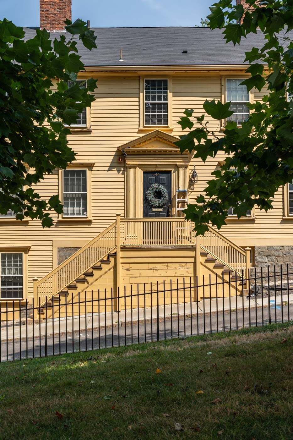 A house with a front porch and a wreath on the door.
