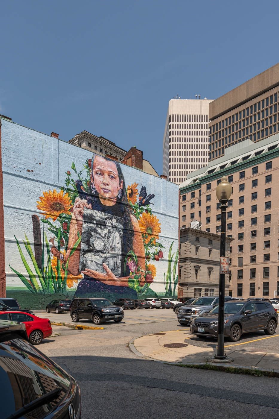 A mural of a person with flowers in Providence