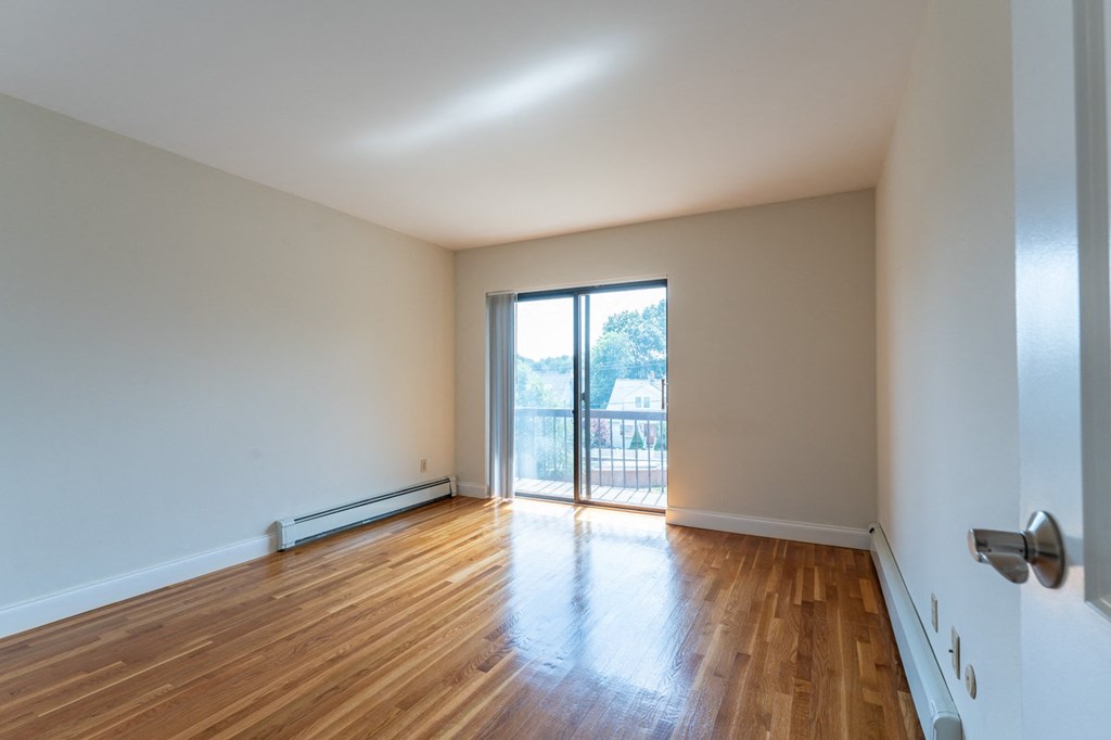 hardwood flooring and balcony slider door