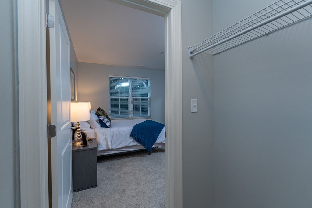 Two bedroom model apartment bedroom with plush carpeting