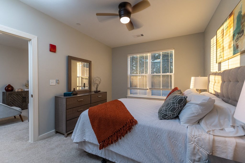 redbrook modle apartment bedroom with ceiling fan and large windows