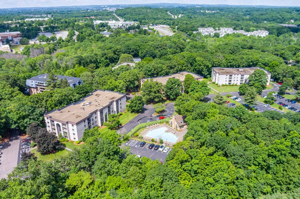 an aerial view of a campus with buildings and a swimming pool