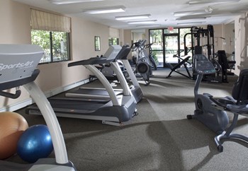 Cardio Equipment in Fitness Center at Shrewsbury Commons Apartments Gym at Shrewsbury Commons Apartments - Photo Gallery 5