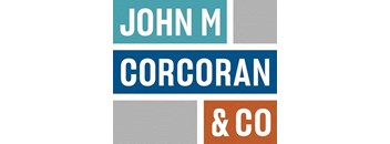 A blue and orange sign with the words "John M Corcoran & Co" on it.