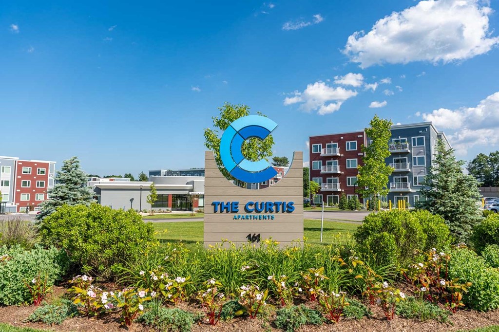 the condos at the curtis sign in front of the building