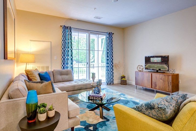 Model apartment living room family room with balcony and furnishings