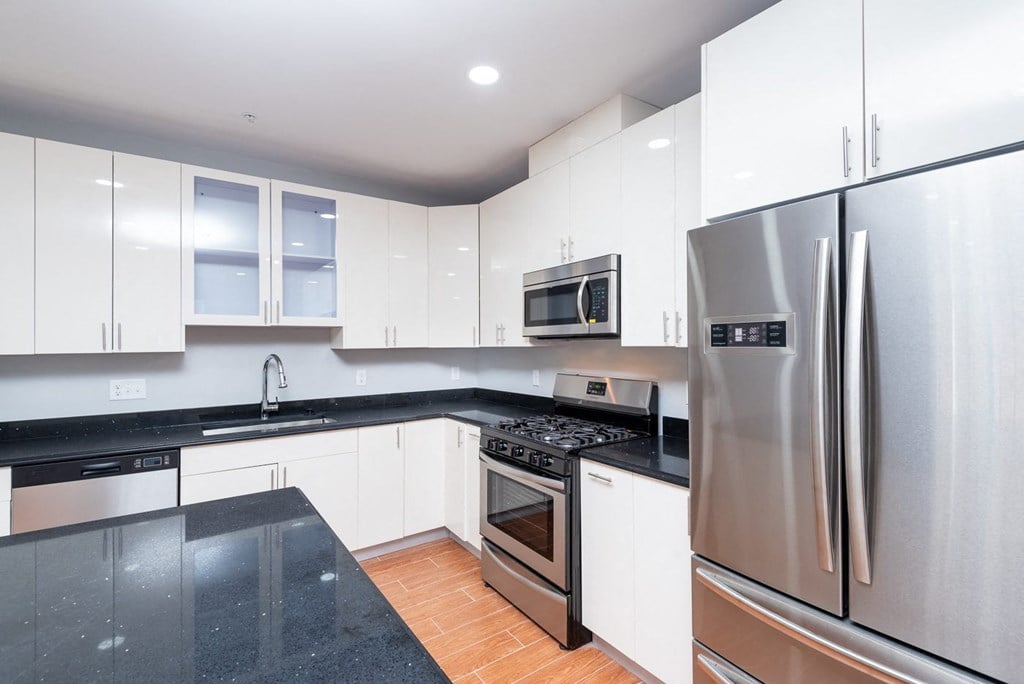 Open concept kitchen with stainless appliances